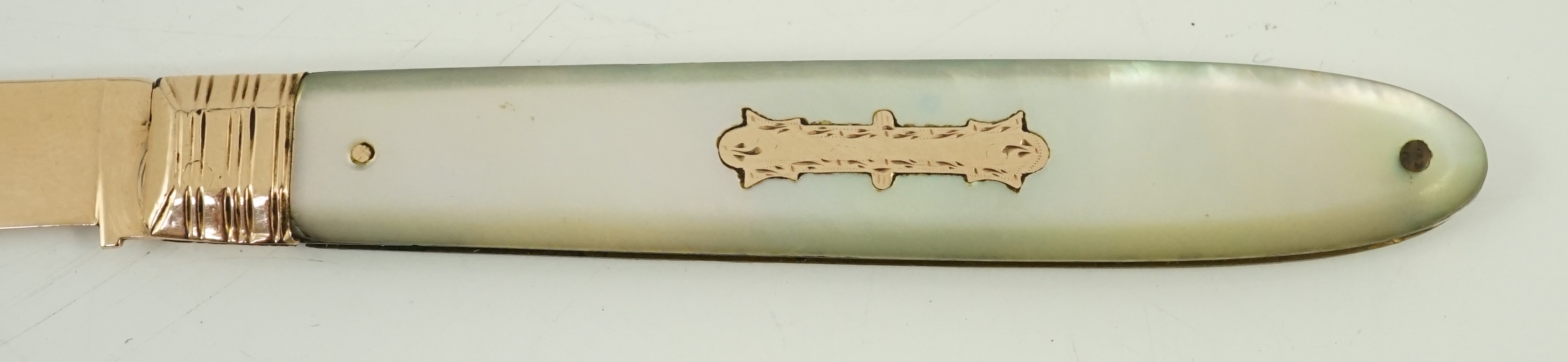 A George III mother of pearl mounted gold fruit knife